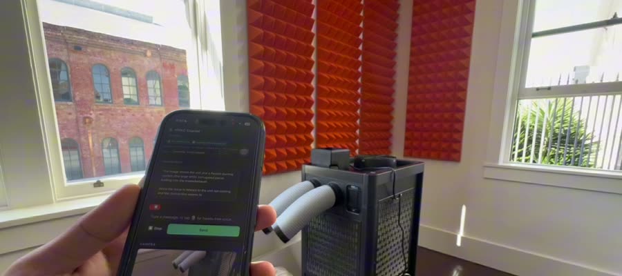 A hand holding a phone up to a portable air conditioner; the prototype identifies the unit on screen